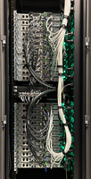 The back of a rack with computational nodes and their cables